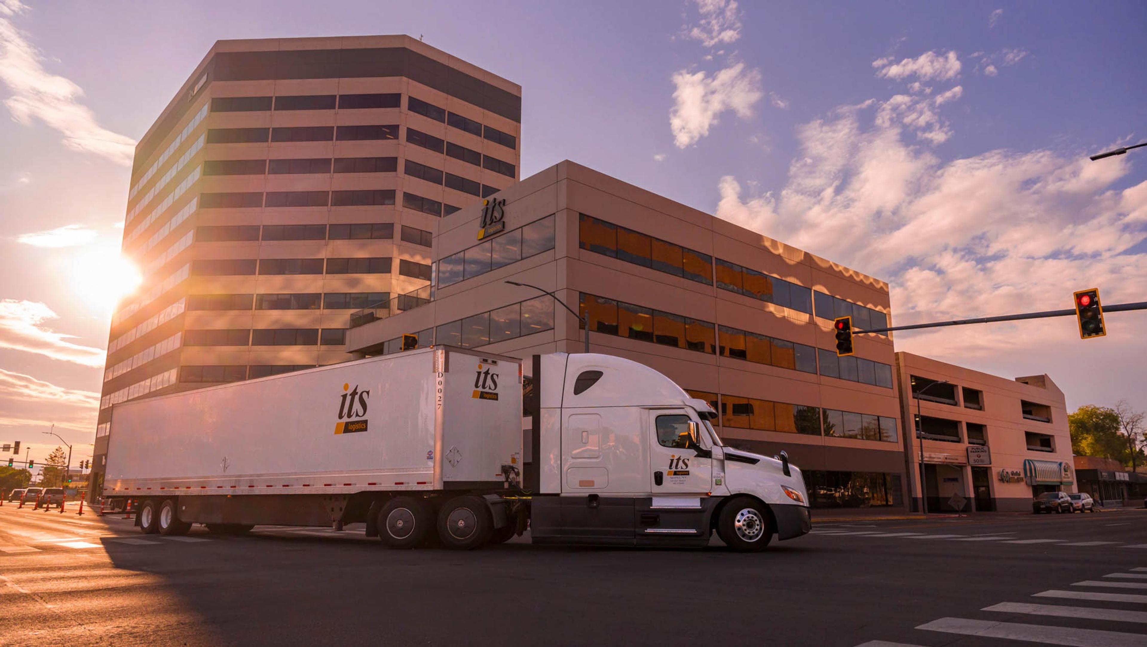 ITS truck driving by ITS corporate building