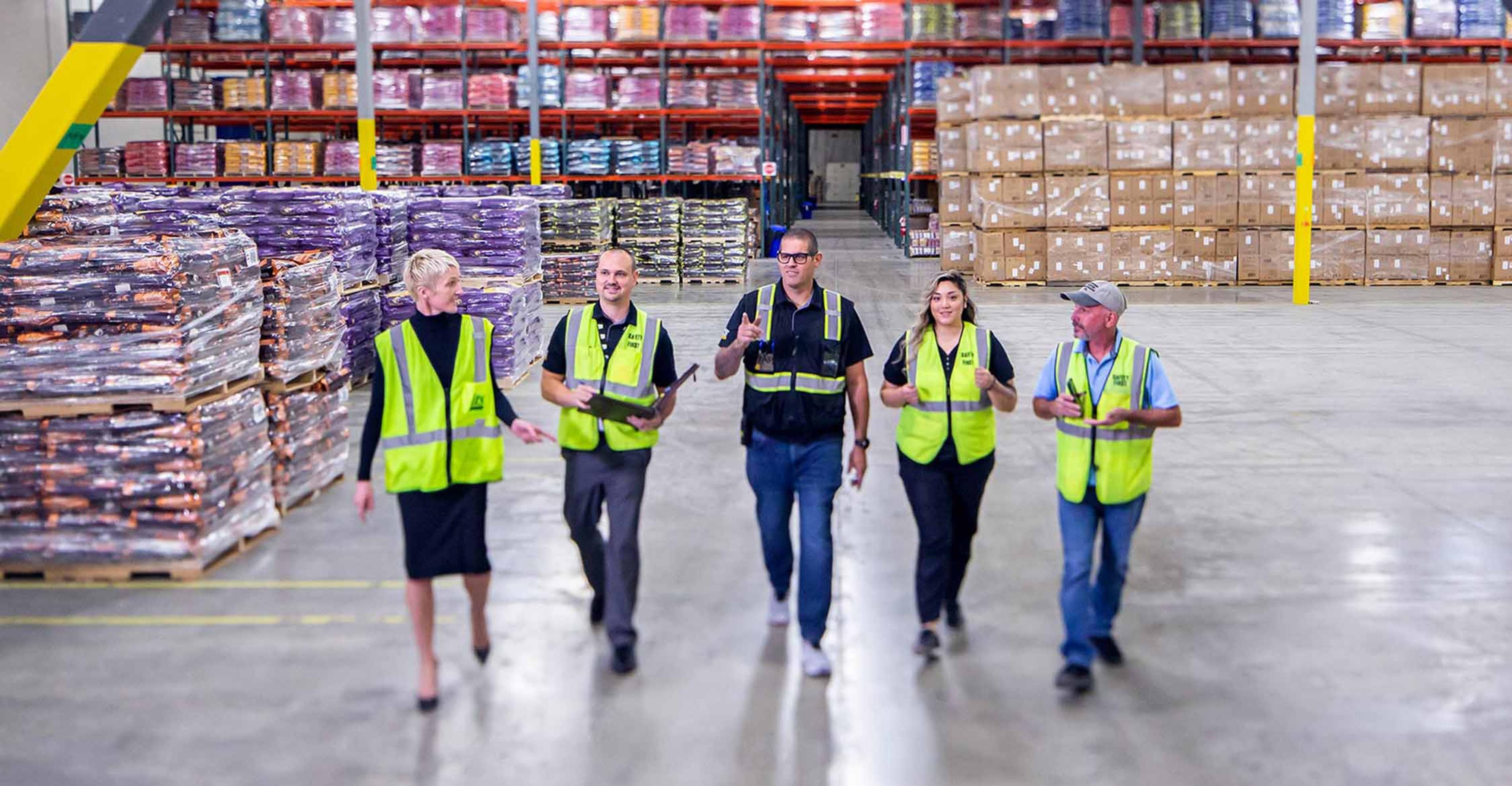 A group of ITS employees making their way through a distribution center