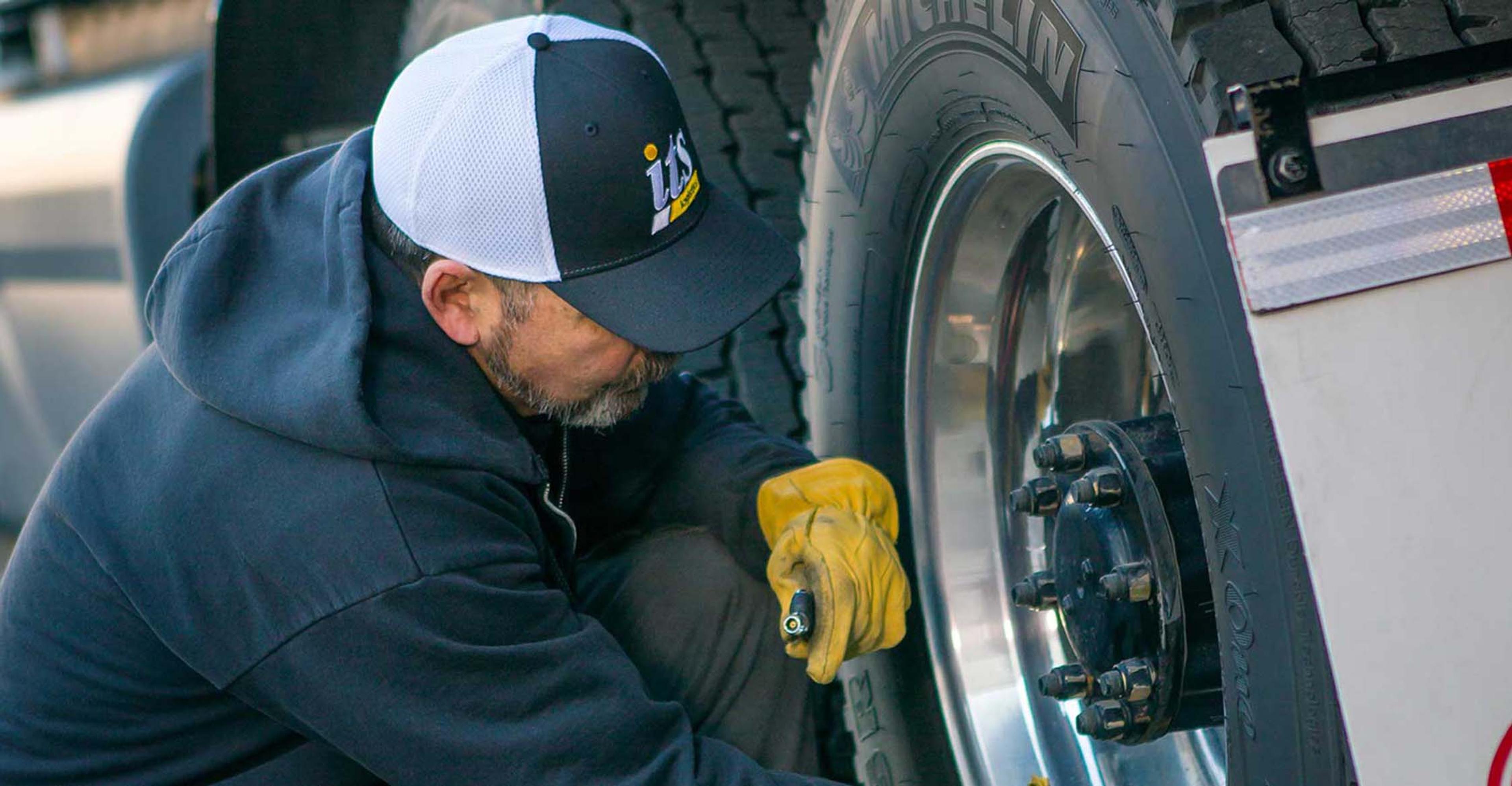 An ITS driver working on a truck