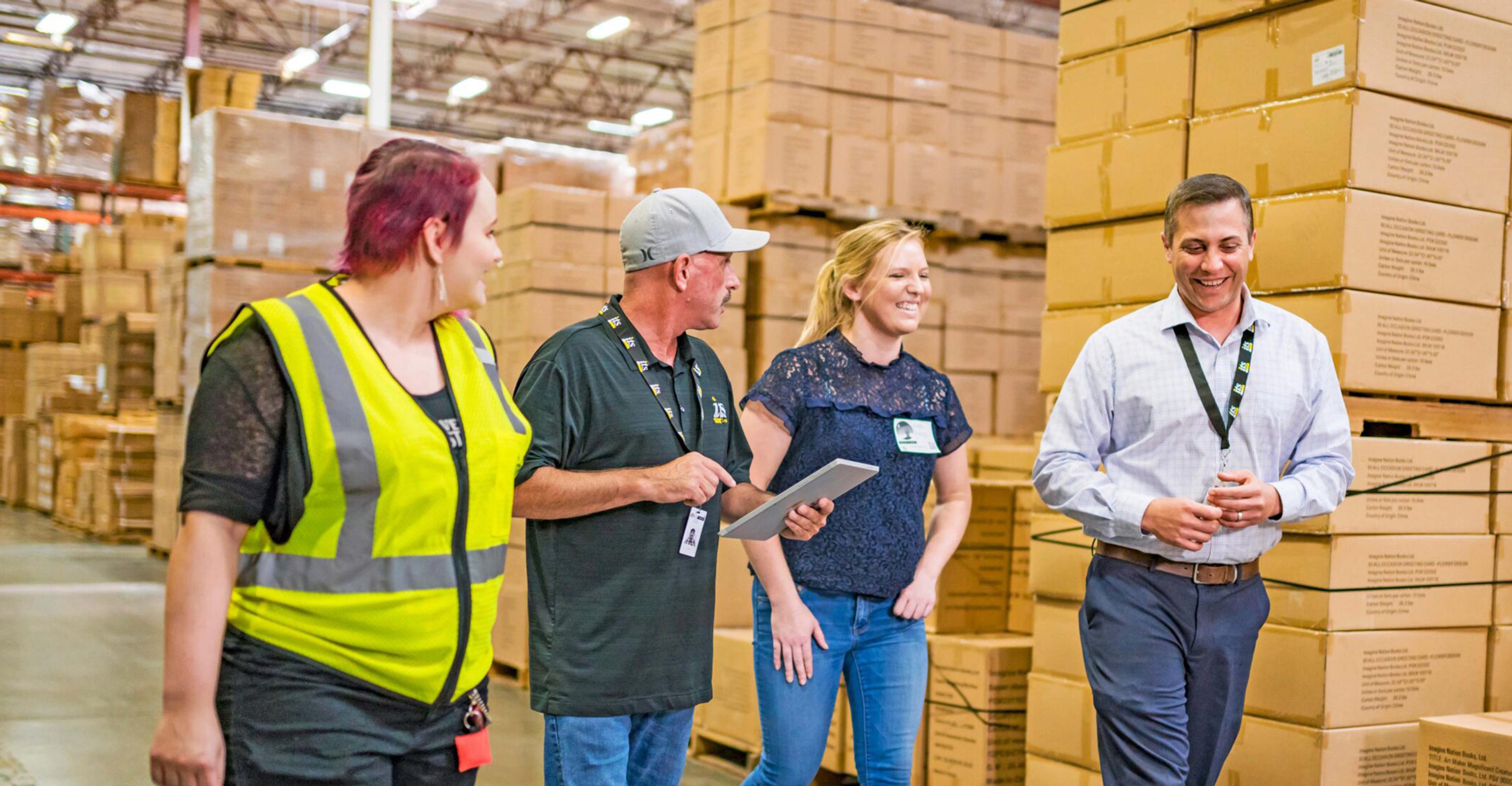 A group of ITS team members walking through a warehouse