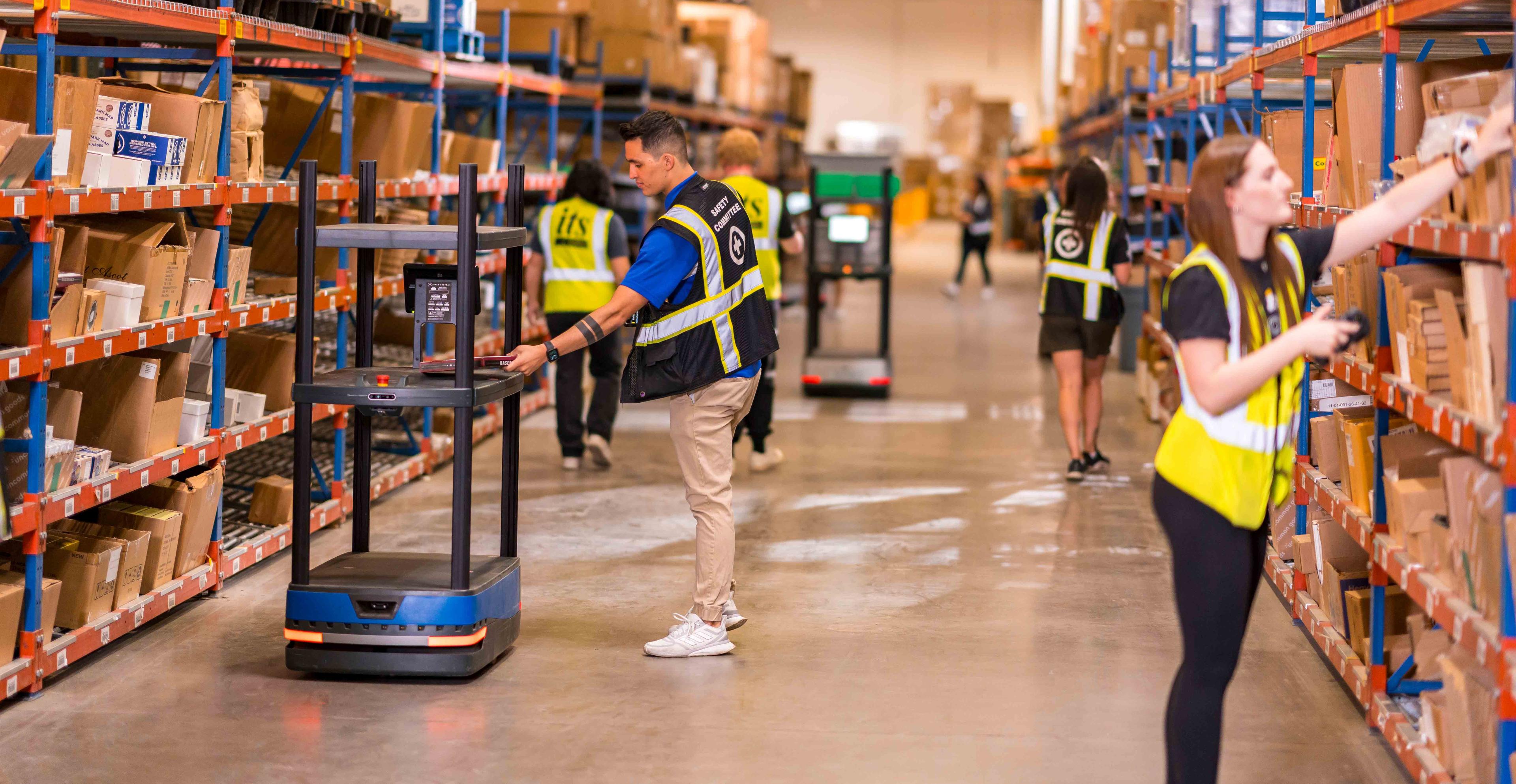 its team members taking inventory of product in a warehouse