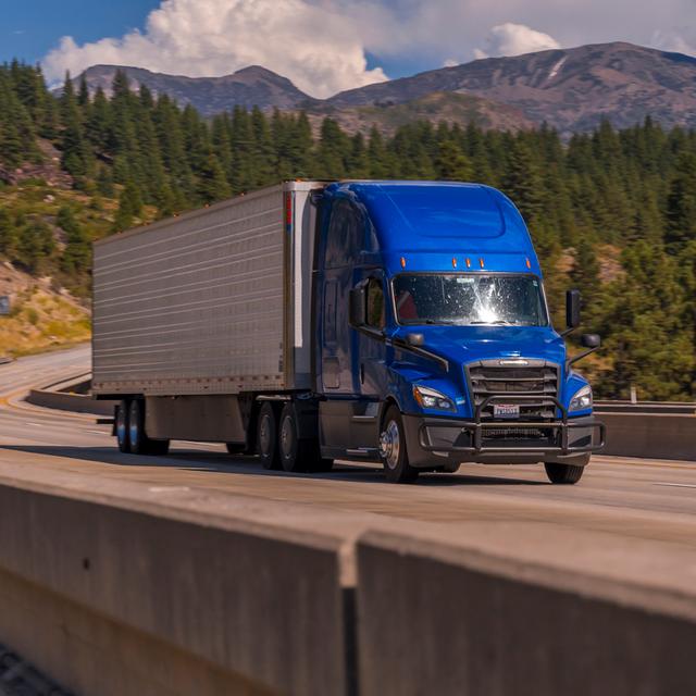 A truck driving across a bridge