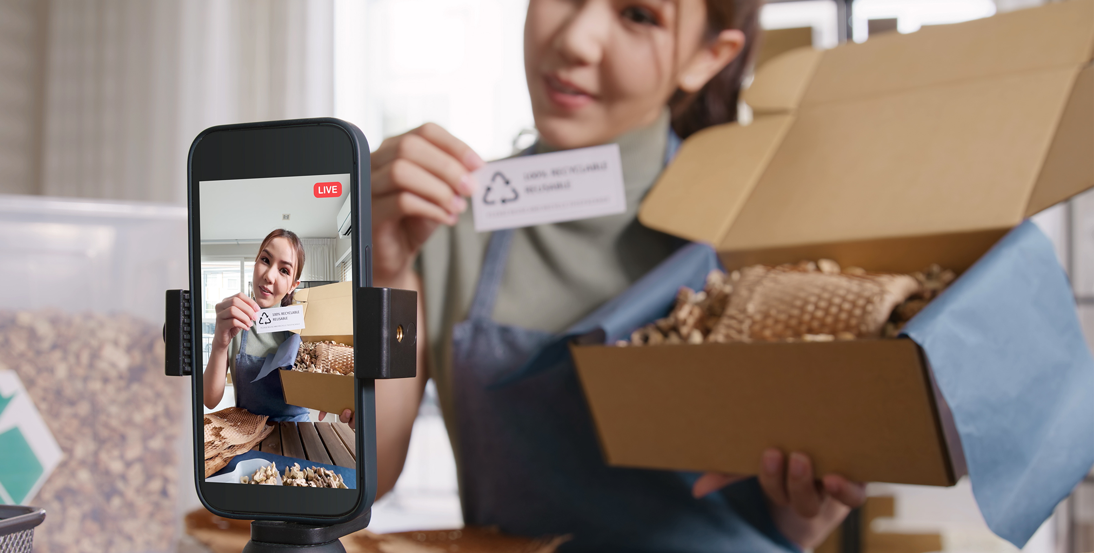 a woman recording an unboxing video of a viral product for social media