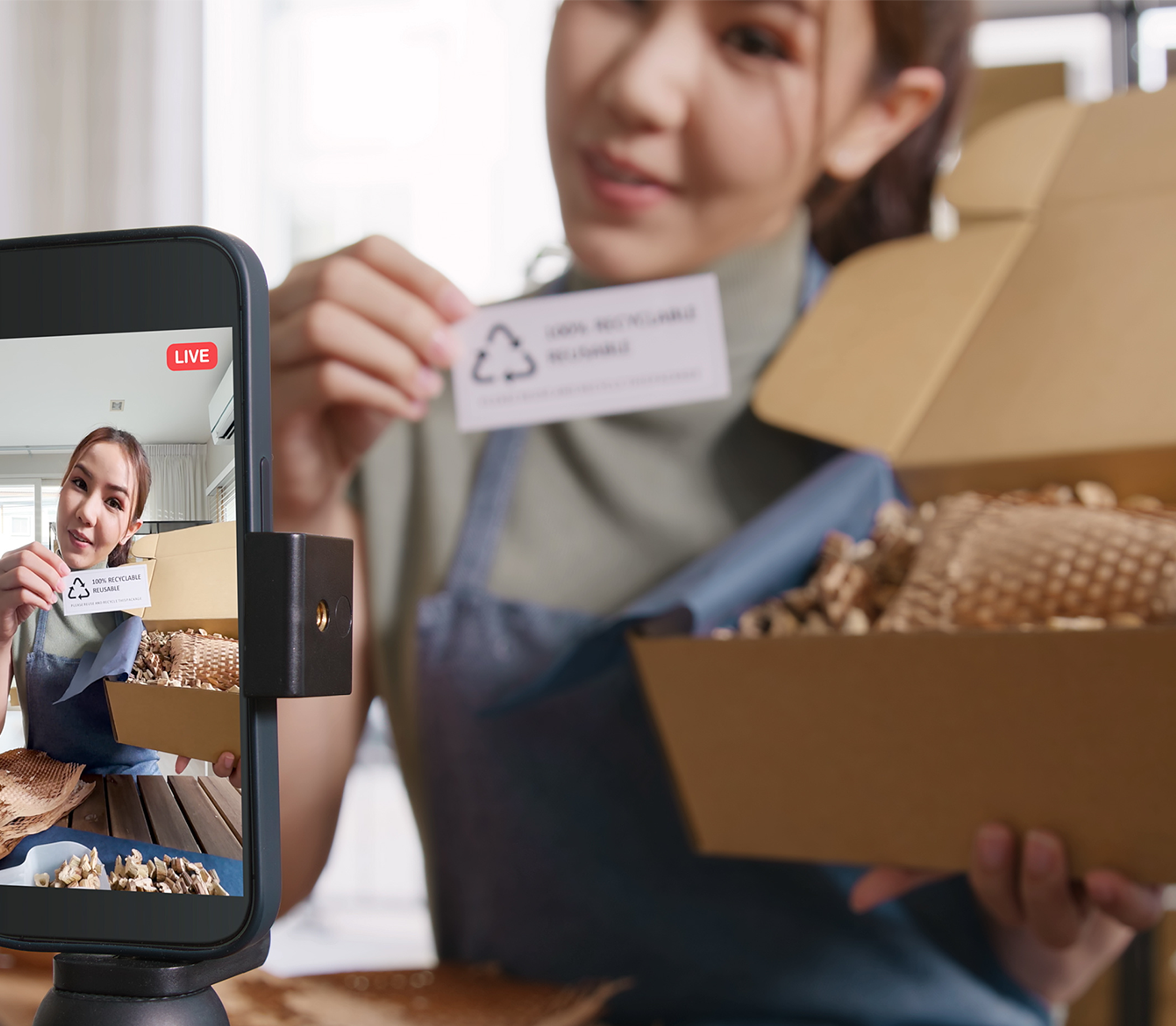 a woman recording an unboxing video of a viral product for social media