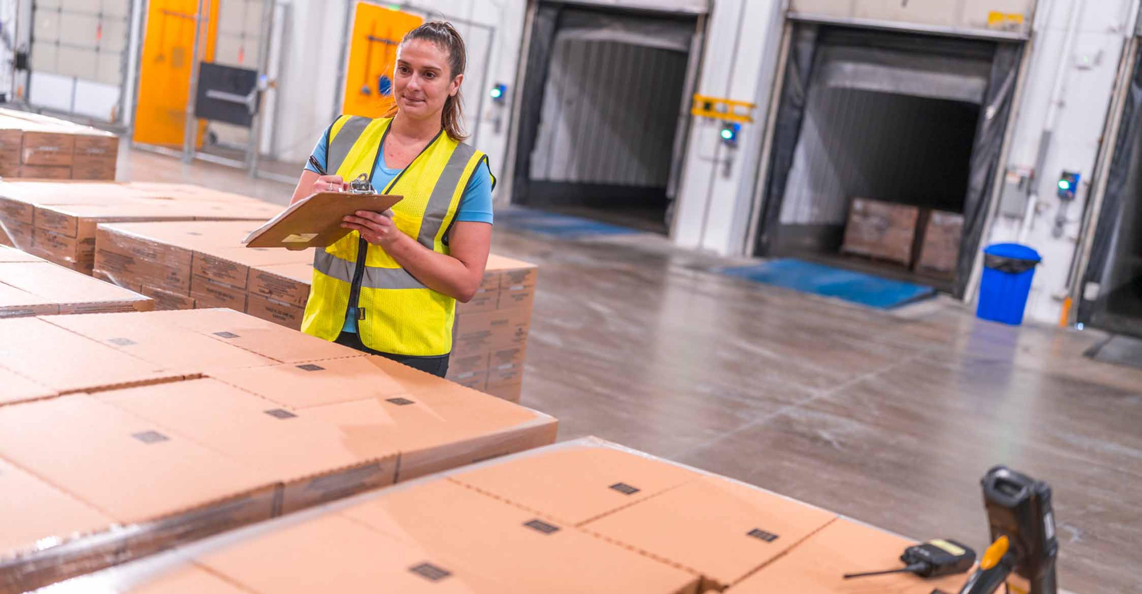 employee double checking cargo before it's loaded into the trailers