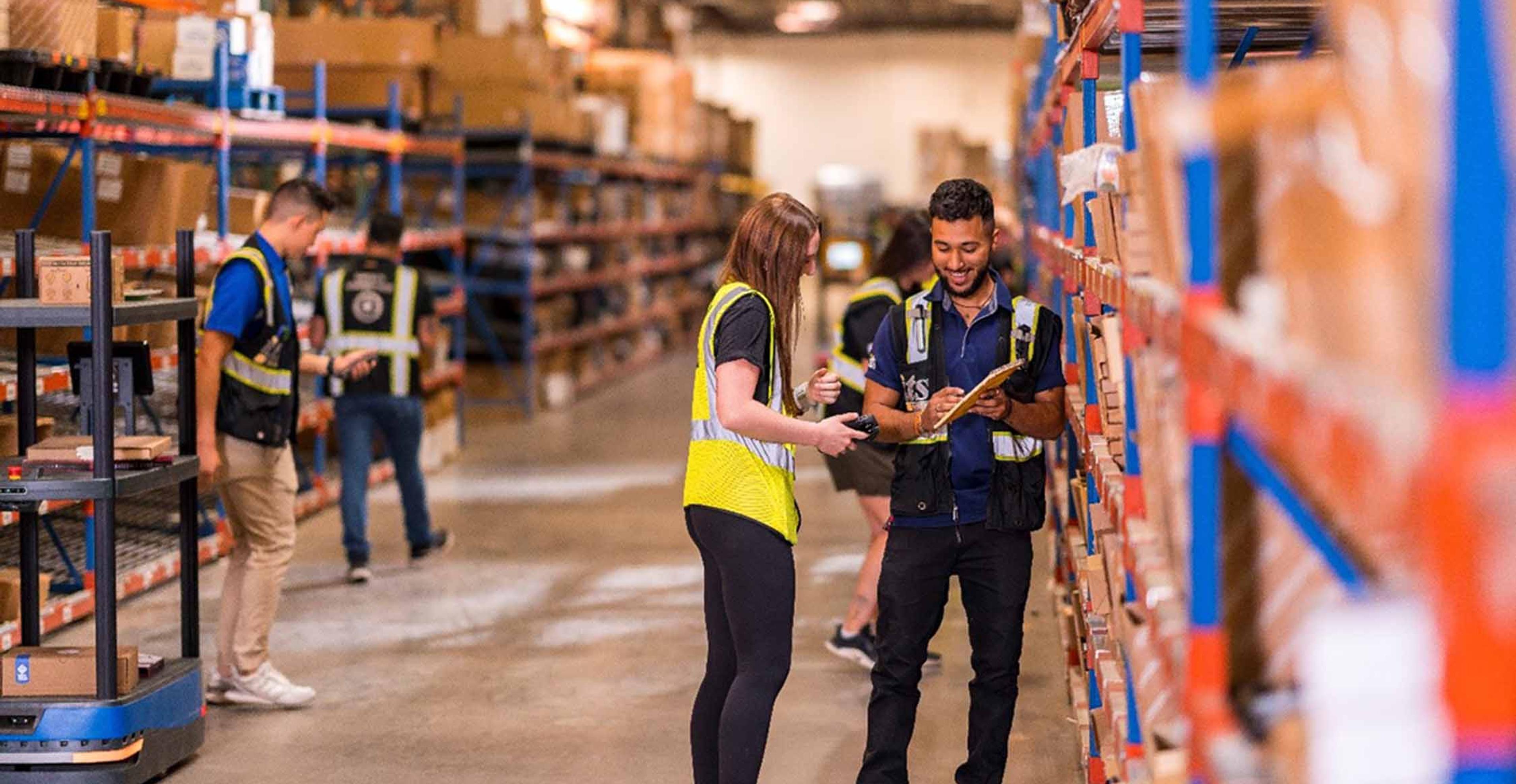 Two ITS team members working in a Texas distribution center.