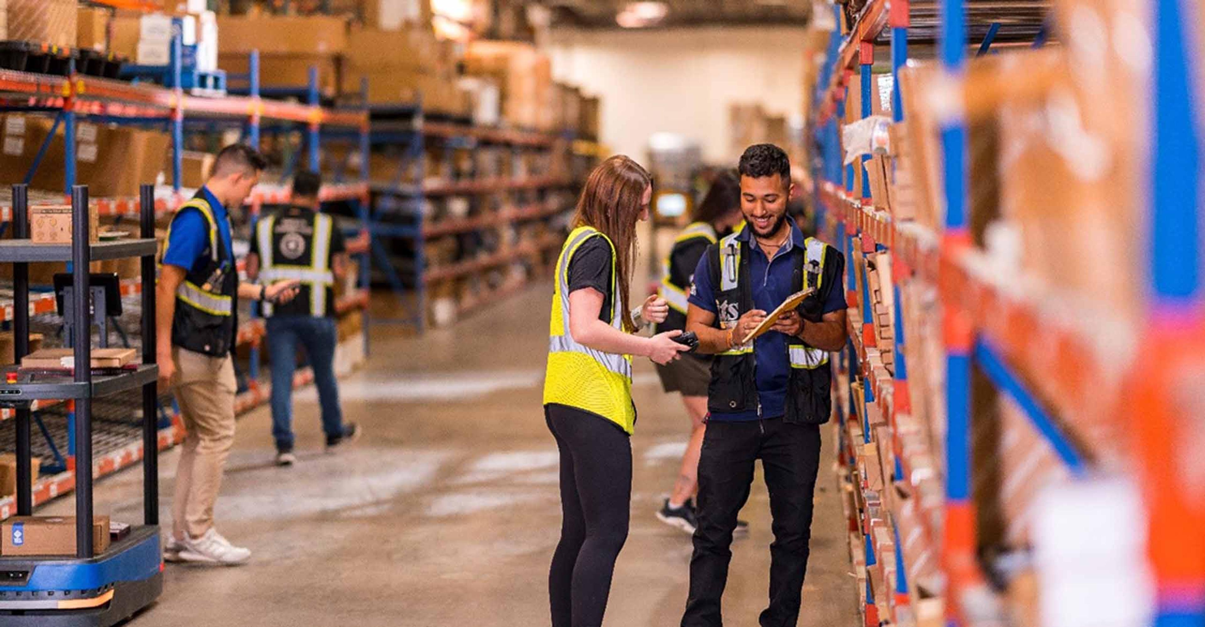 Two ITS team members working in a Texas distribution center.