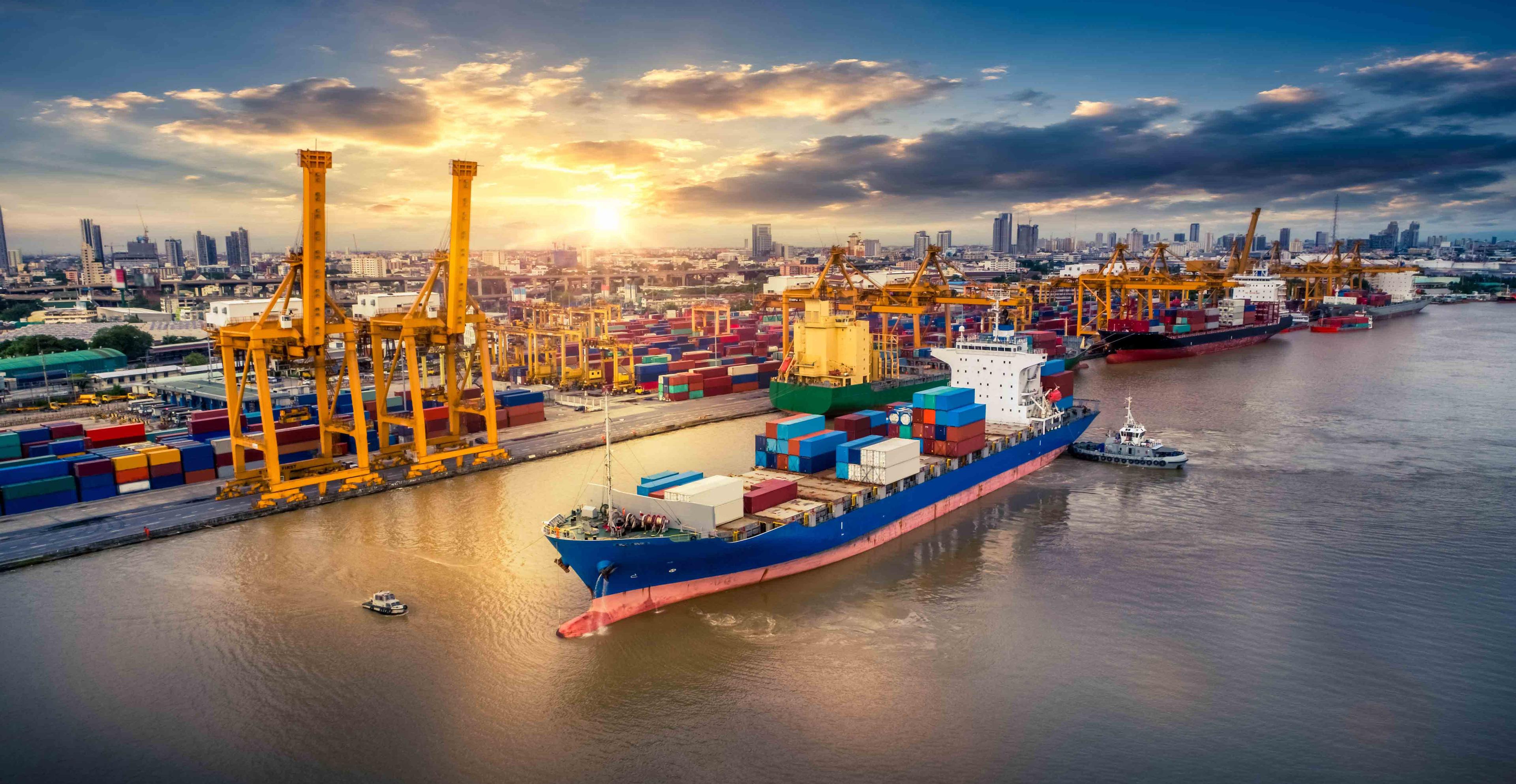 Intermodal transportation of Container Cargo ship and Cargo plane with working crane bridge in shipyard at sunrise