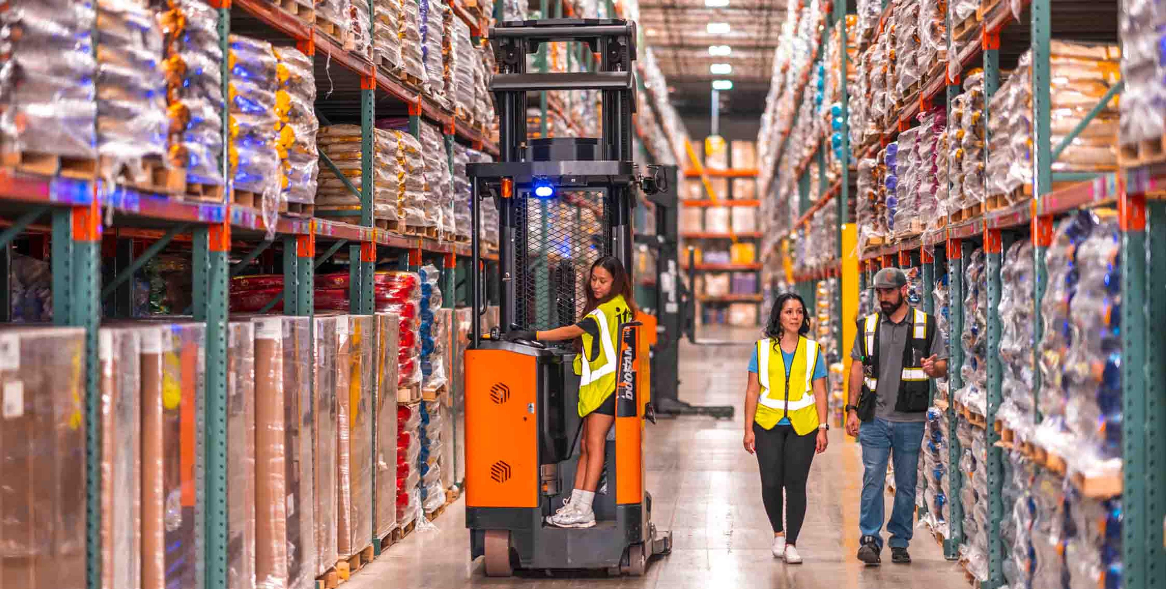 two managers discussing the factors that affect warehousing costs