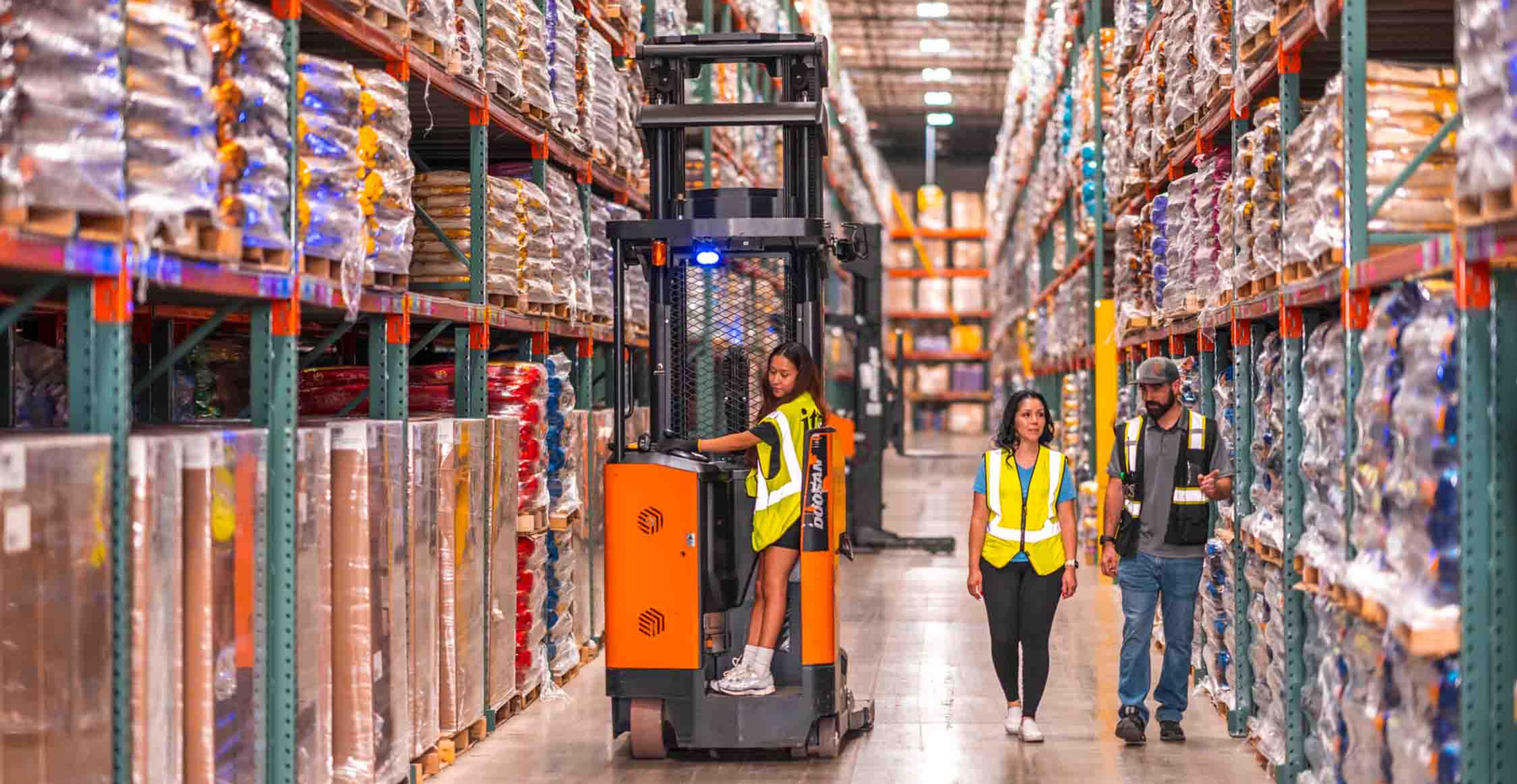 two managers discussing the factors that affect warehousing costs