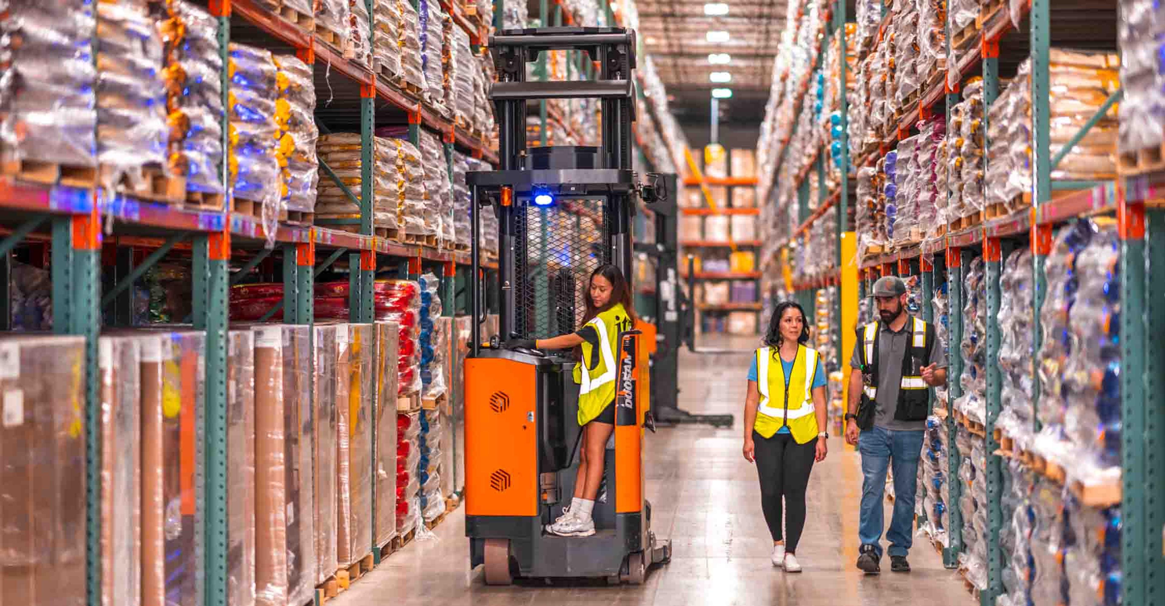 two managers discussing the factors that affect warehousing costs