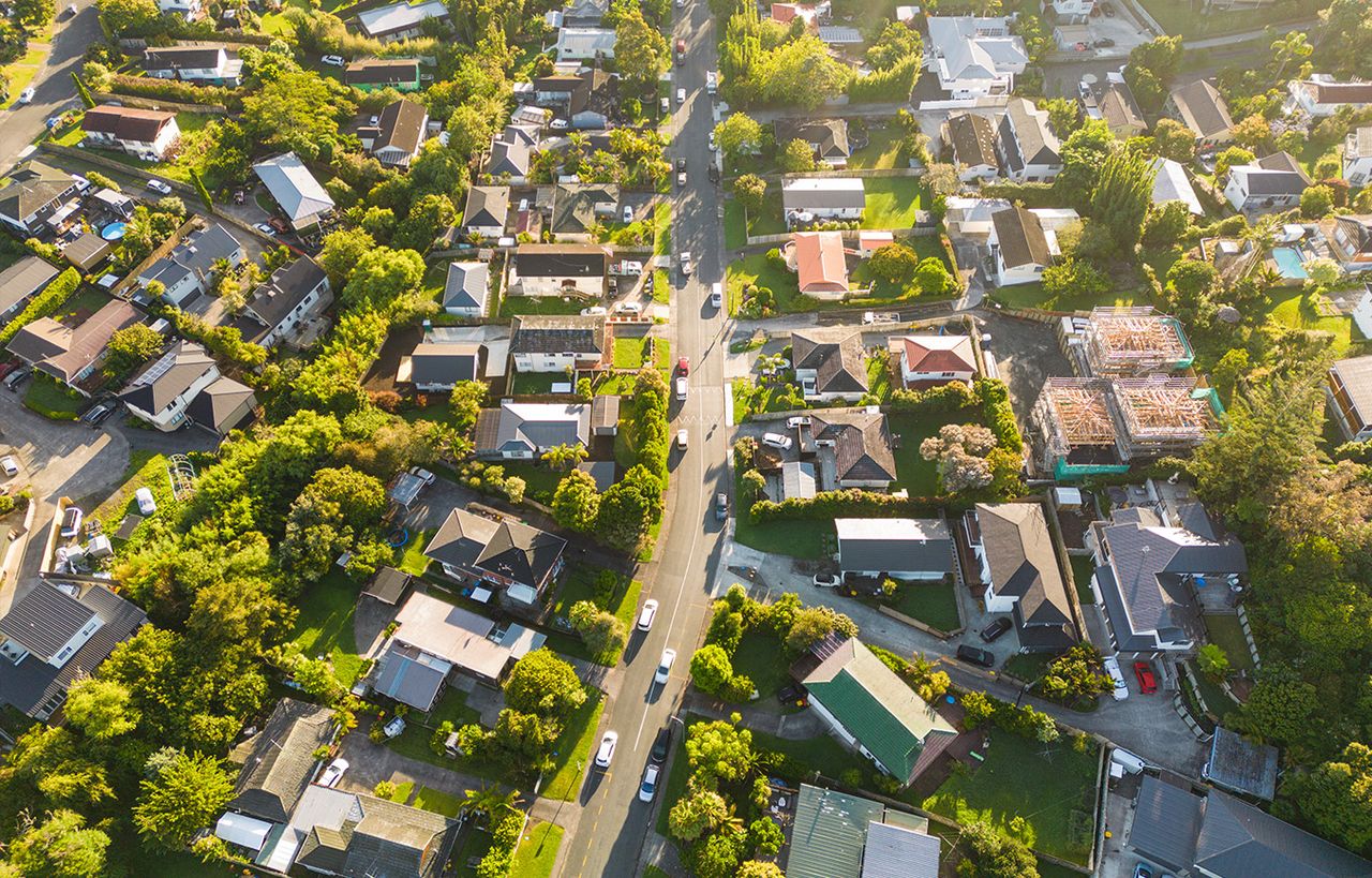 Aerial view of a leafy suburb and its local roads