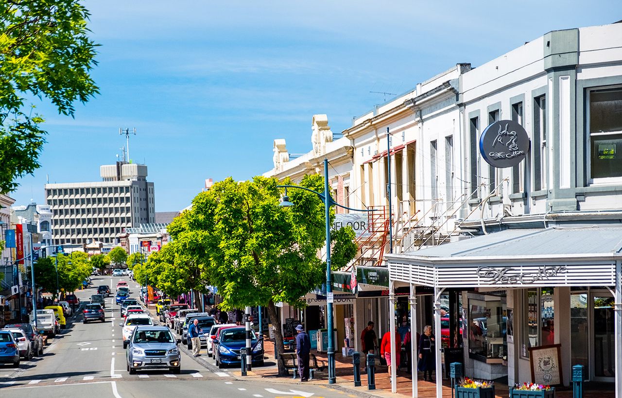 Main street in Timaru with shops and traffic