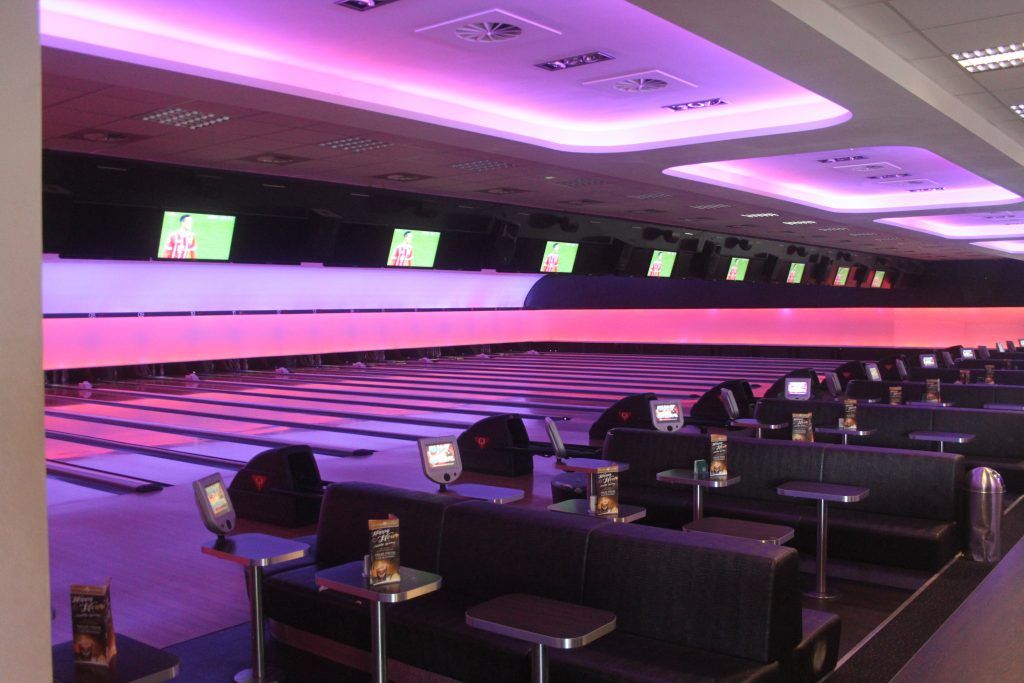 Seating beside the lanes at Bowling Lounge MG.