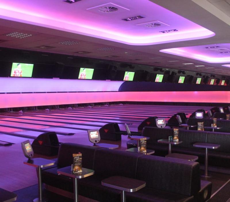 Seating beside the bowling lanes.
