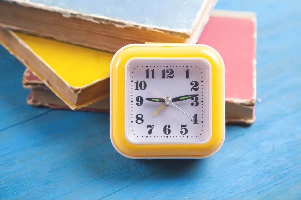 clock and books
