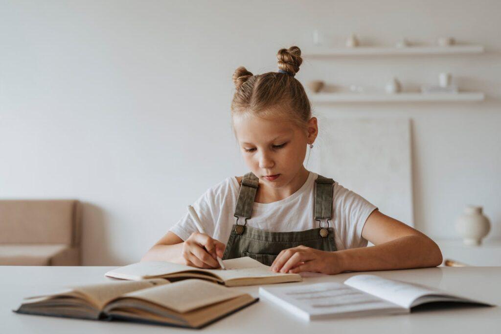 A child studying on her own