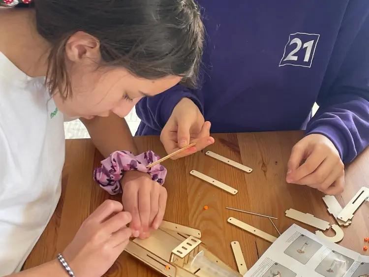 small girls working on STEAM activity at mont21 school