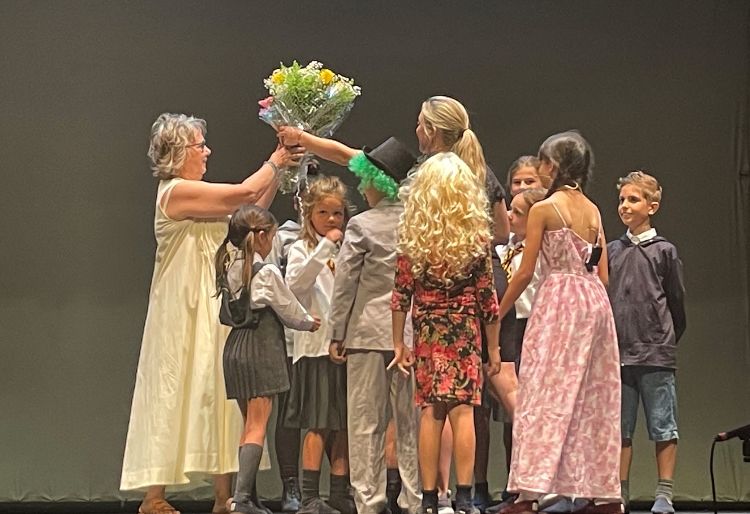 presentation of flowers at end of school performance 