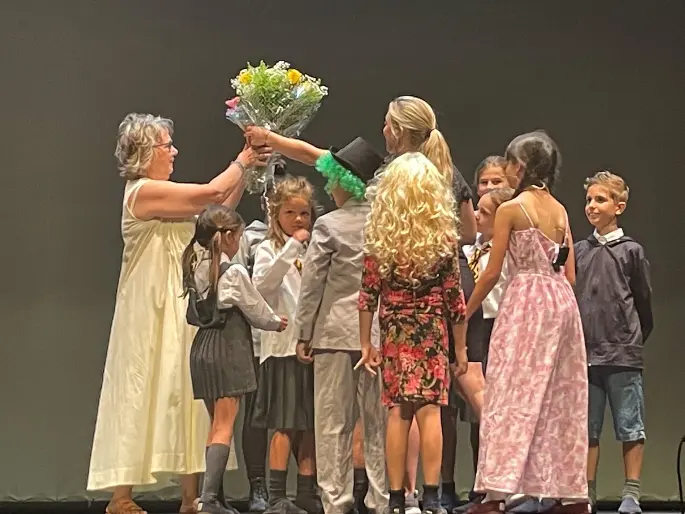 presentation of flowers at end of school performance