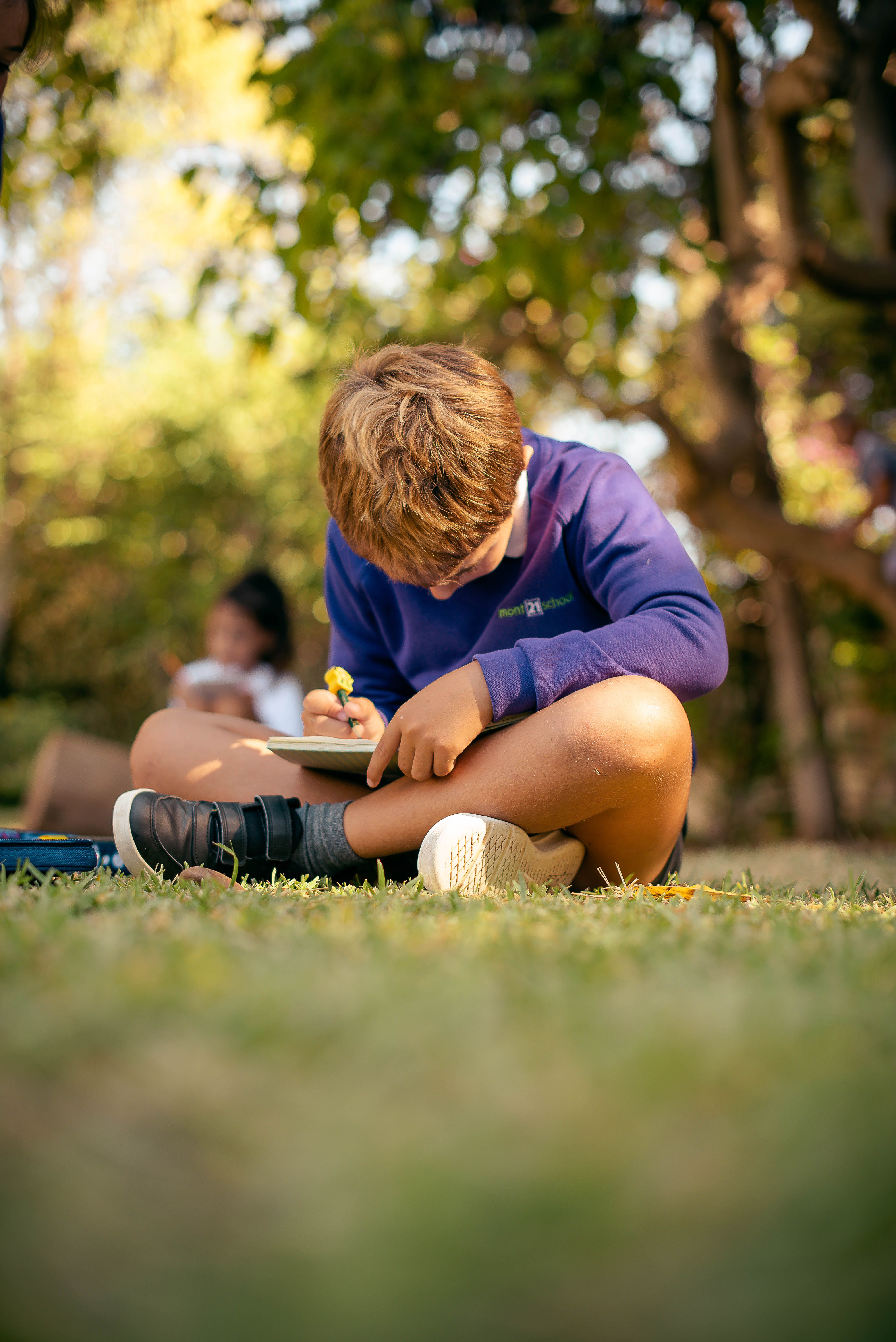 small school boy working in outside environment