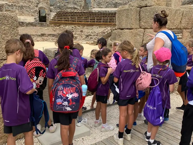 school group on educational trip to roman remains in southern Spain