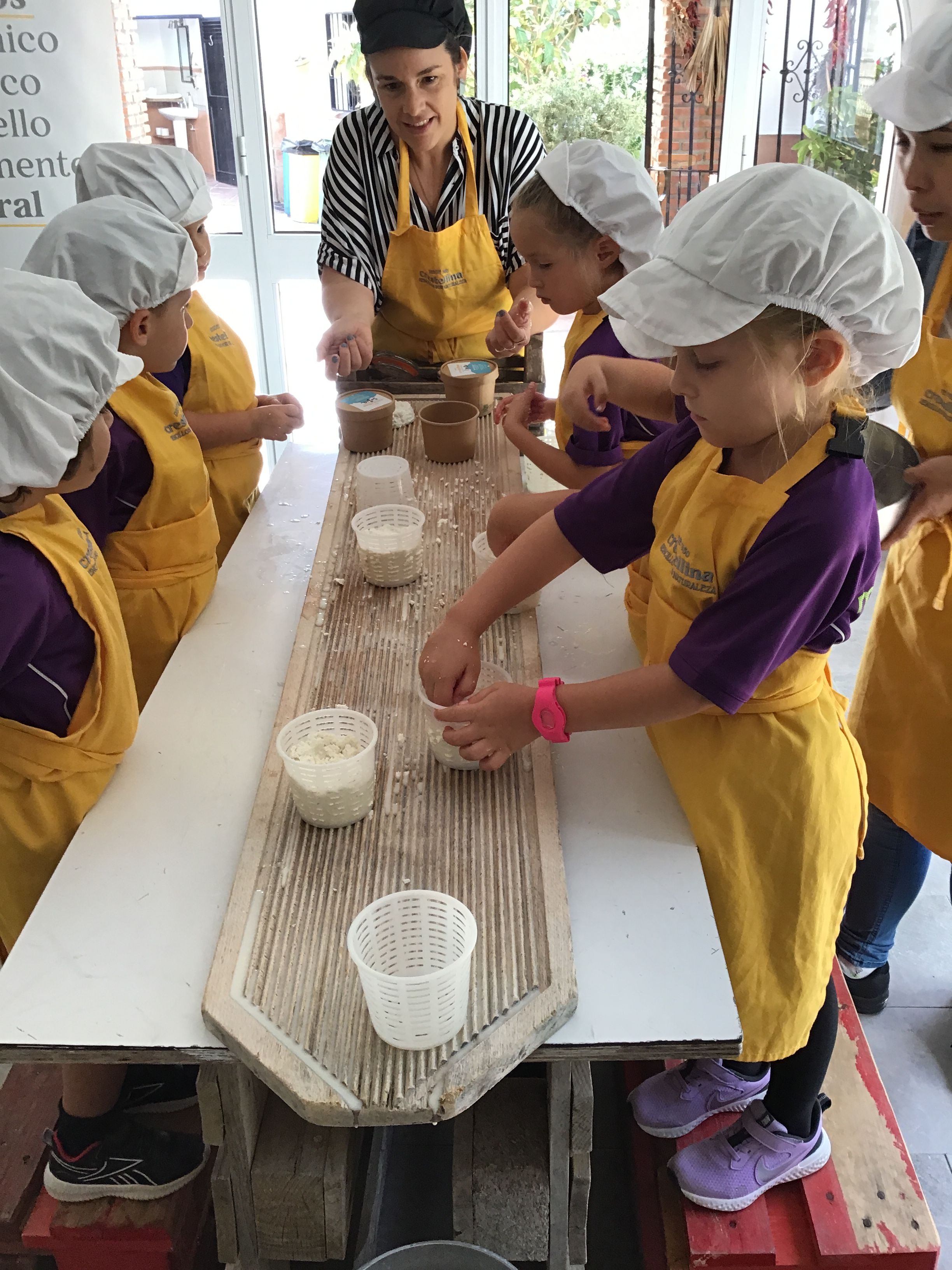 young kids enjoying chocolate making in Spain