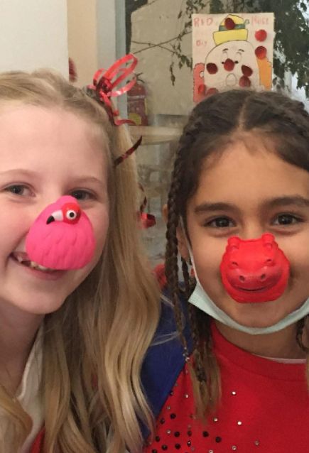 young girls with funny noses for red nose charity