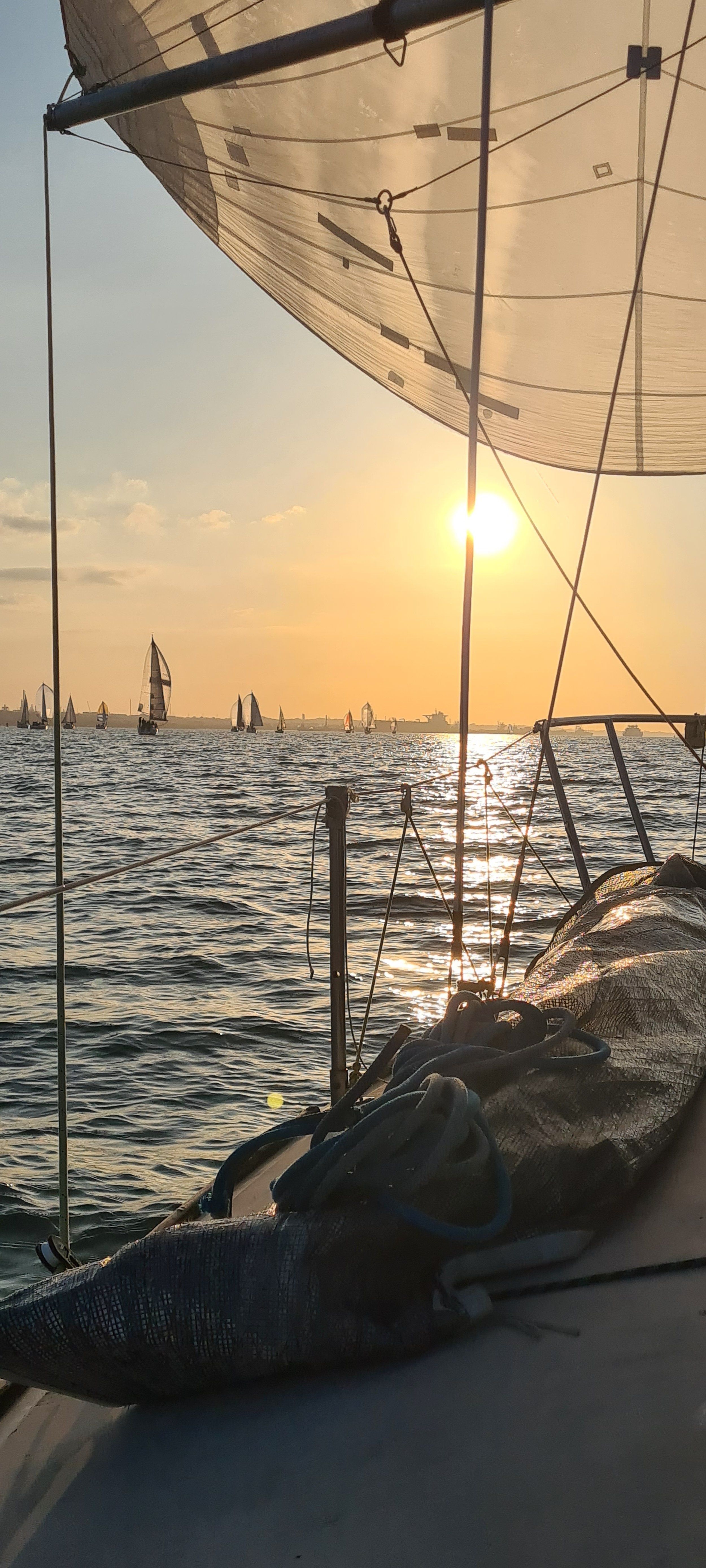 Boats at sunset from another boat | Pearl Marine
