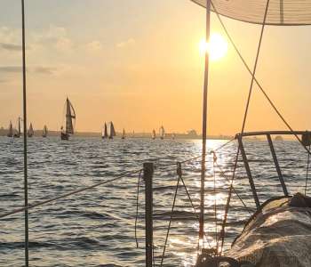 Boats at sunset from another boat | Pearl Marine
