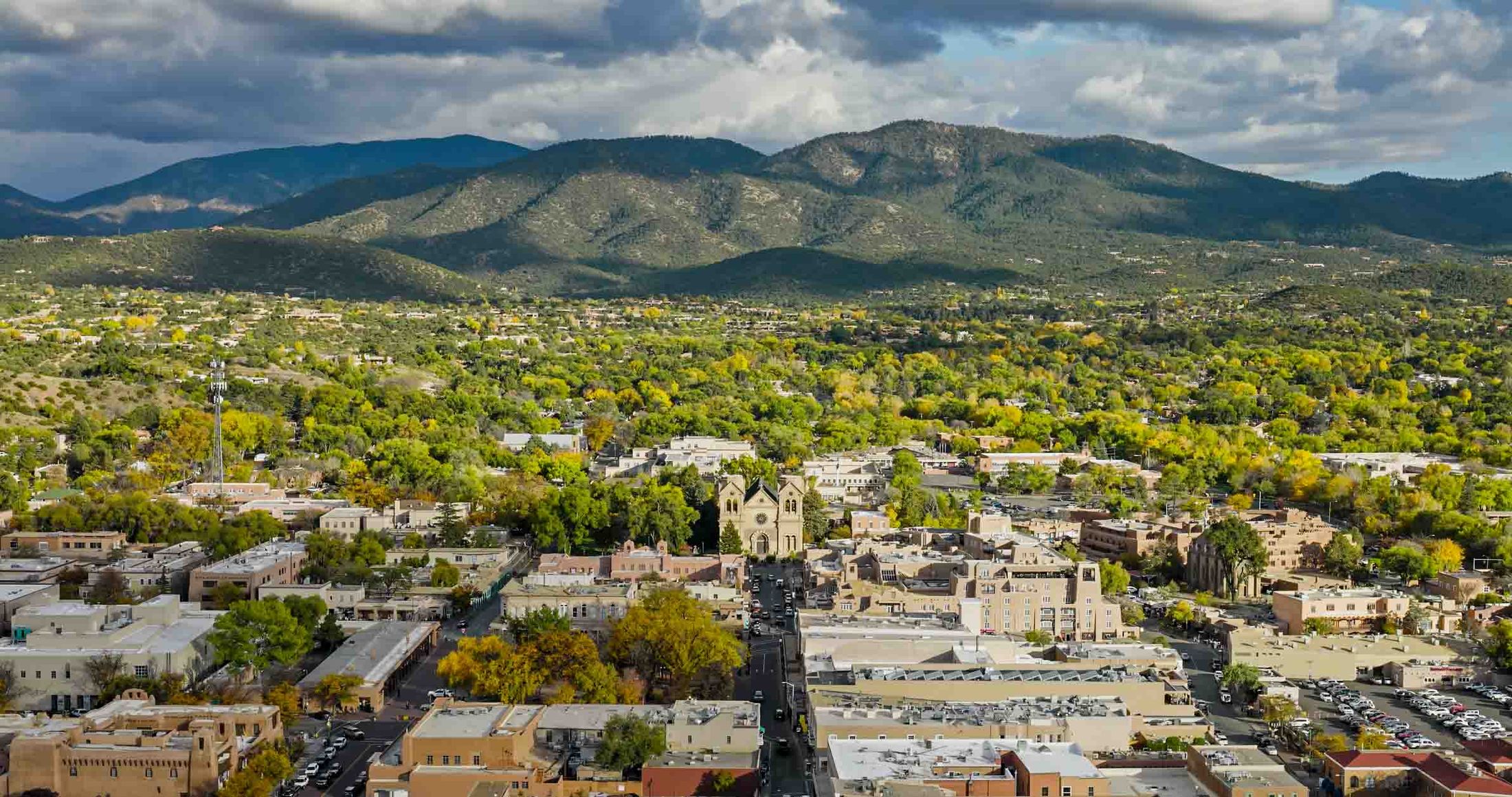 Aerial view of downtown Santa Fe with the Sangre de Cristo Mountains beyond