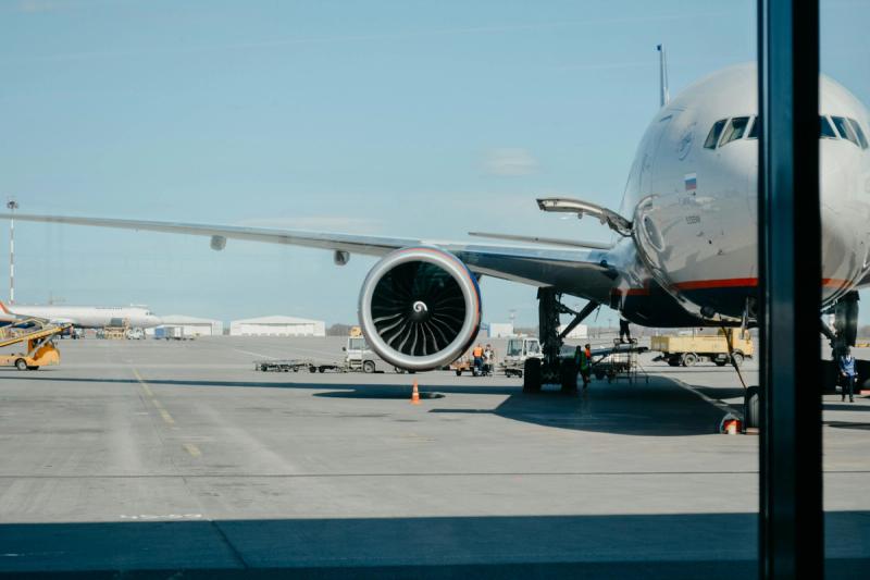 Airplane sat at a terminal building