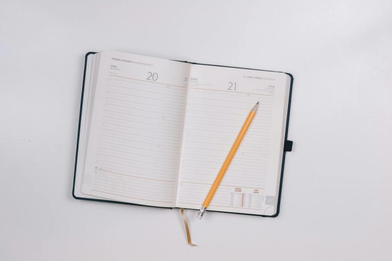 An open calendar notebook