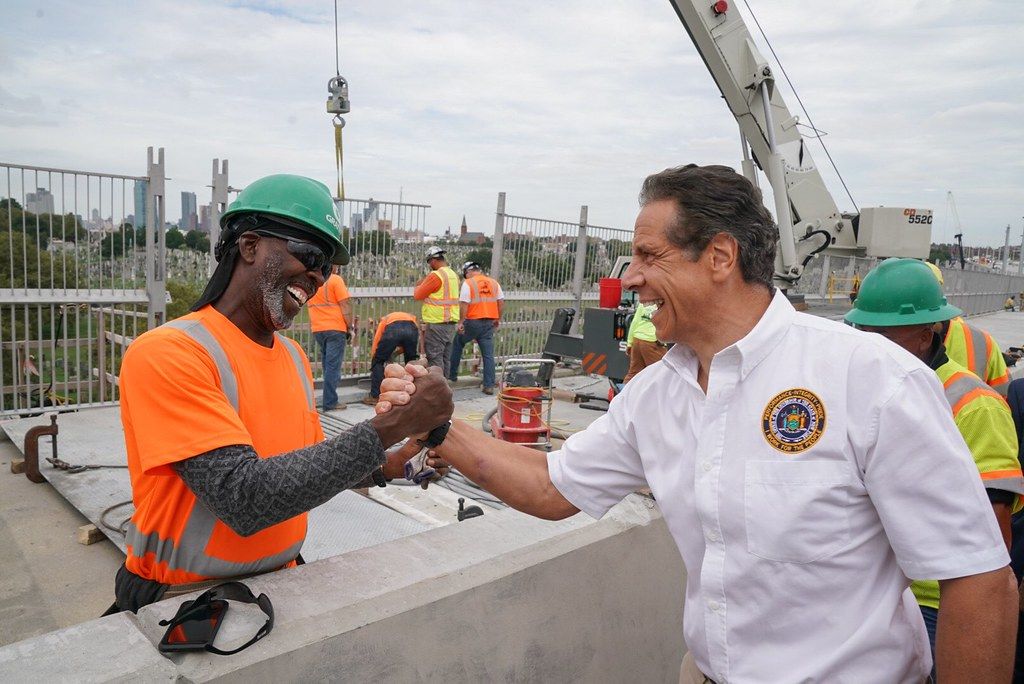 Governor Cuomo embracing a construction worker