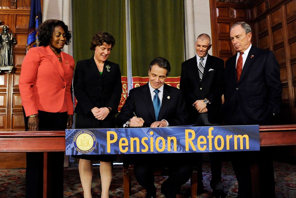 Cuomo signing a Pension Reform bill