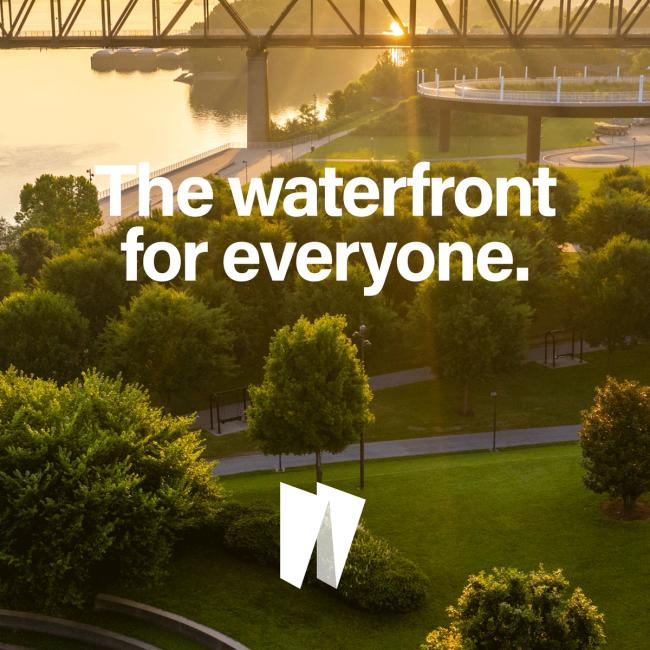 Text that reads The Waterfront for everyone and Waterfront logo mark on aerial image of Waterfront Park