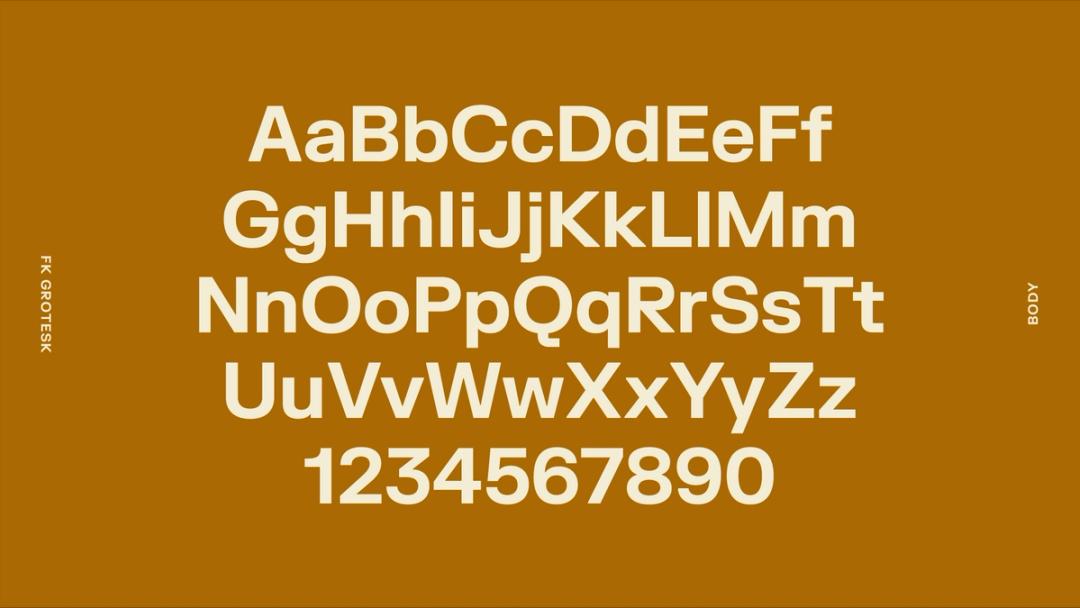 center aligned alphabet, off white sans serif on a golden background