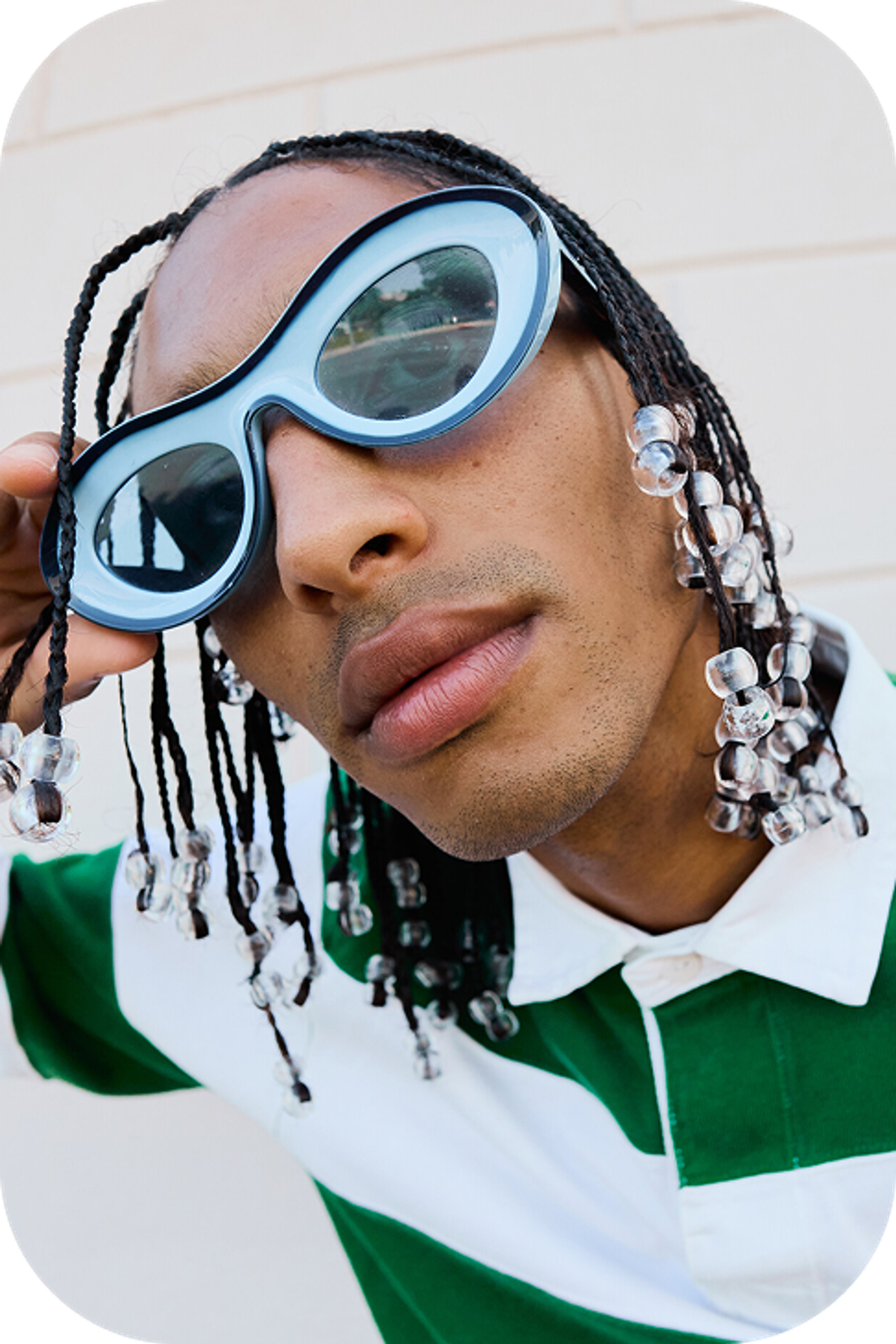 Blond white girl with rings and green blouse