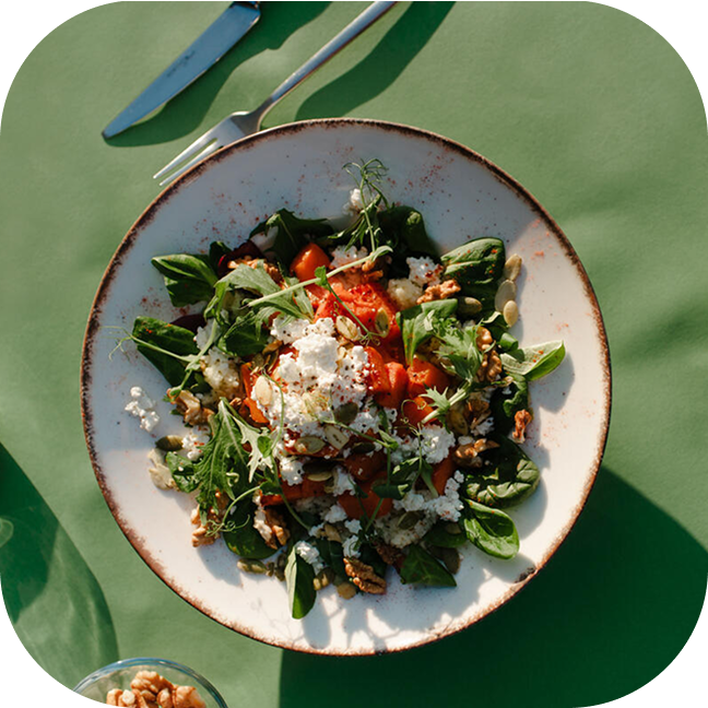 A plate with salad inside