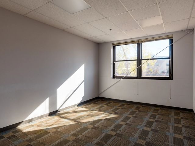 Empty private office with natural light and autumn view at Black Lab Sports, Boulder, CO
