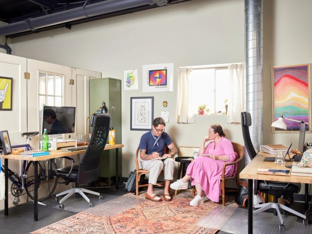 Personalized dedicated desk with rainbow flag and stickers at The Studio Boulder, Boulder, CO