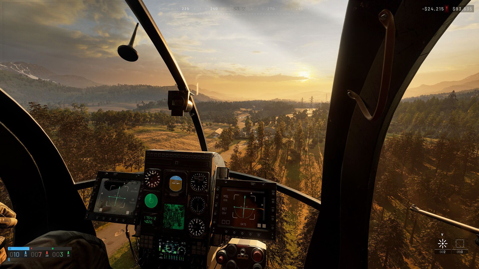 A helicopter cockpit overlooks the WARDOGS battlefield at sunset