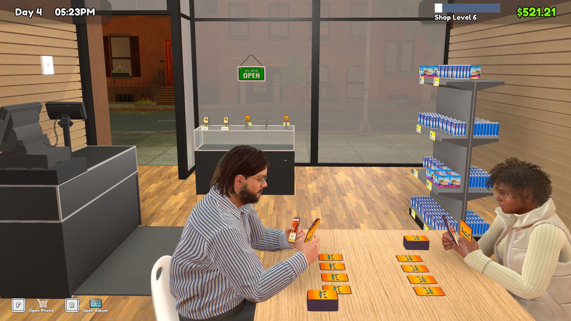 Official TCG Card Shop Simulator screenshot showing a card shop interior with shelves and products.