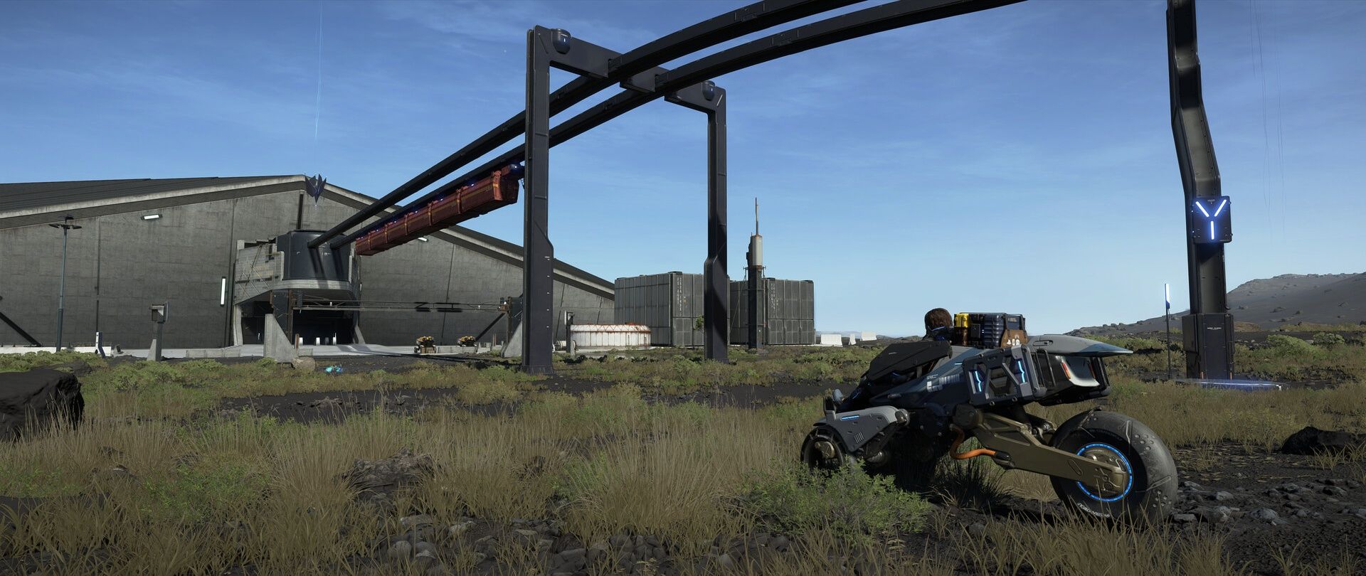 A vehicle waits near infrastructure in Death Stranding 2.