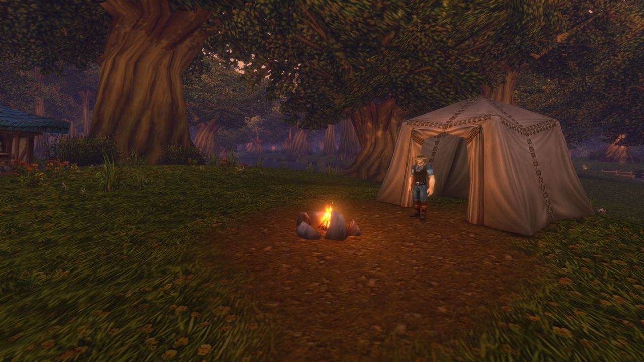 A World of Warcraft adventurer standing beside a tent and campfire in a forest