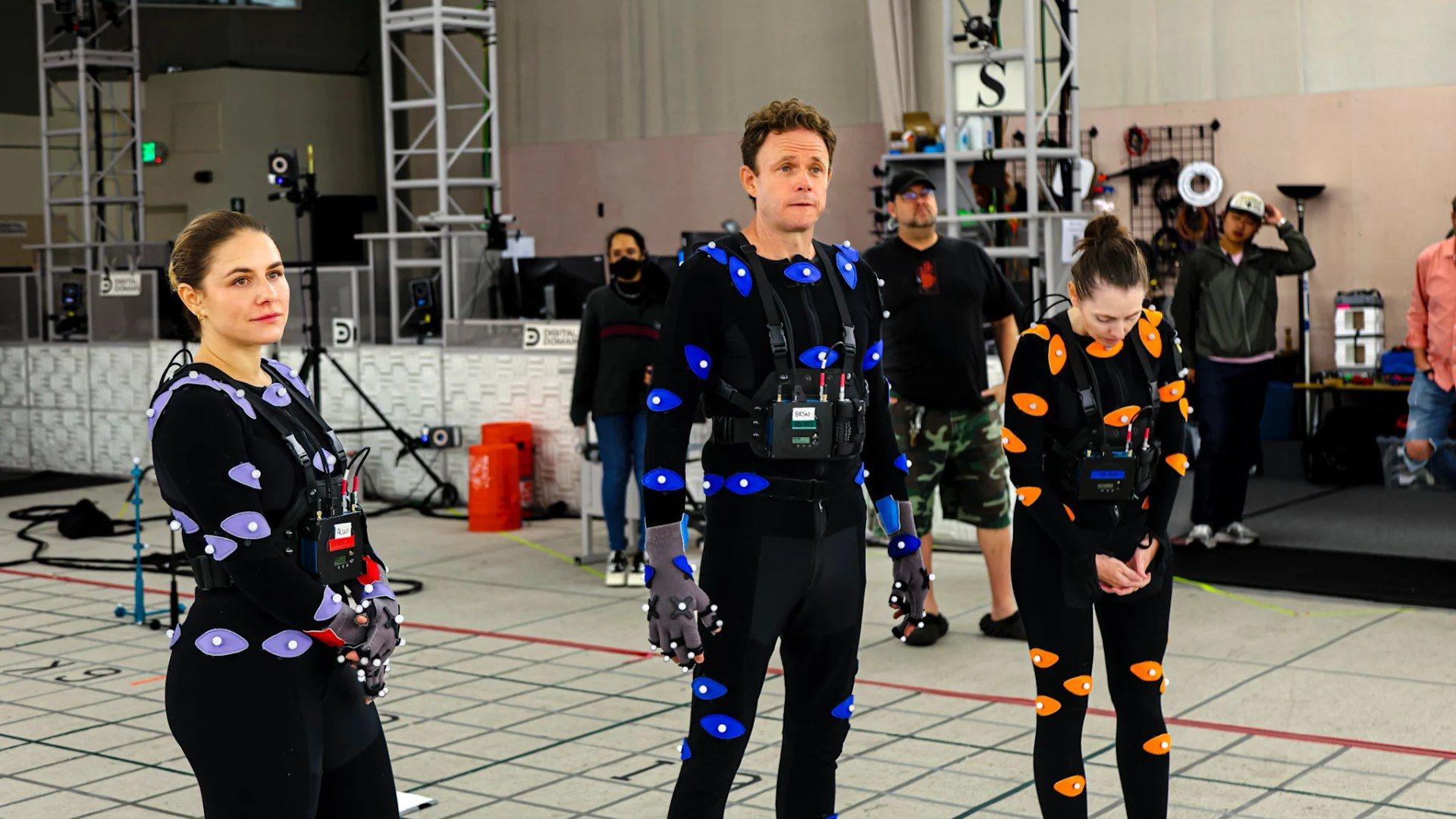 The Tomb Raider: Legacy of Atlantis cast and production team stand together during the Meet Larson shoot.
