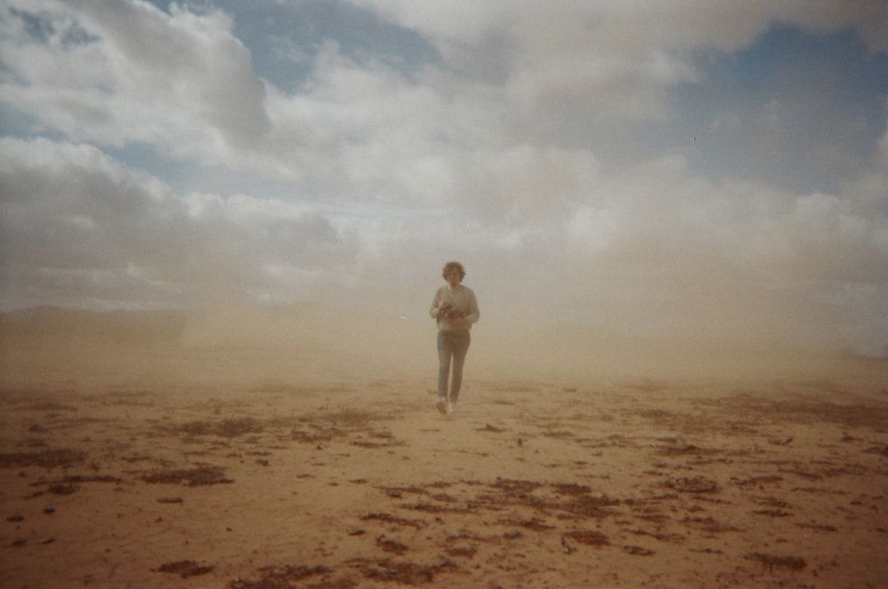 Christian Lopez walking in a desert