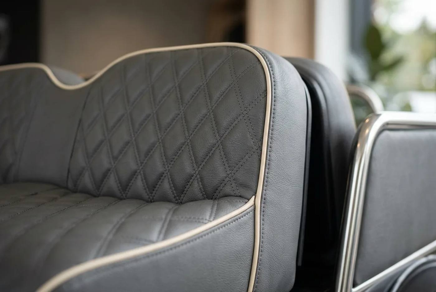 Close detail of stitched leather-look upholstery and matched trim on a premium bespoke electric buggy seat