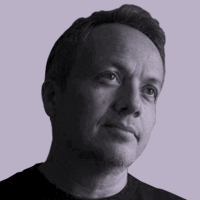Black and white headshot of a featured industry professional on a lavender background