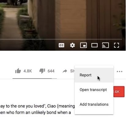 YouTube video menu with the Report option selected, the first step in filing a takedown request